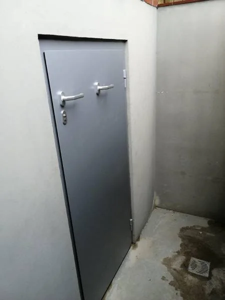 Installed flood-resistant door
