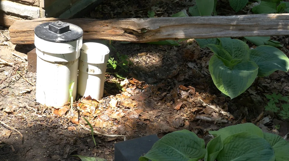 Exterior access risers for a backwater valve installation