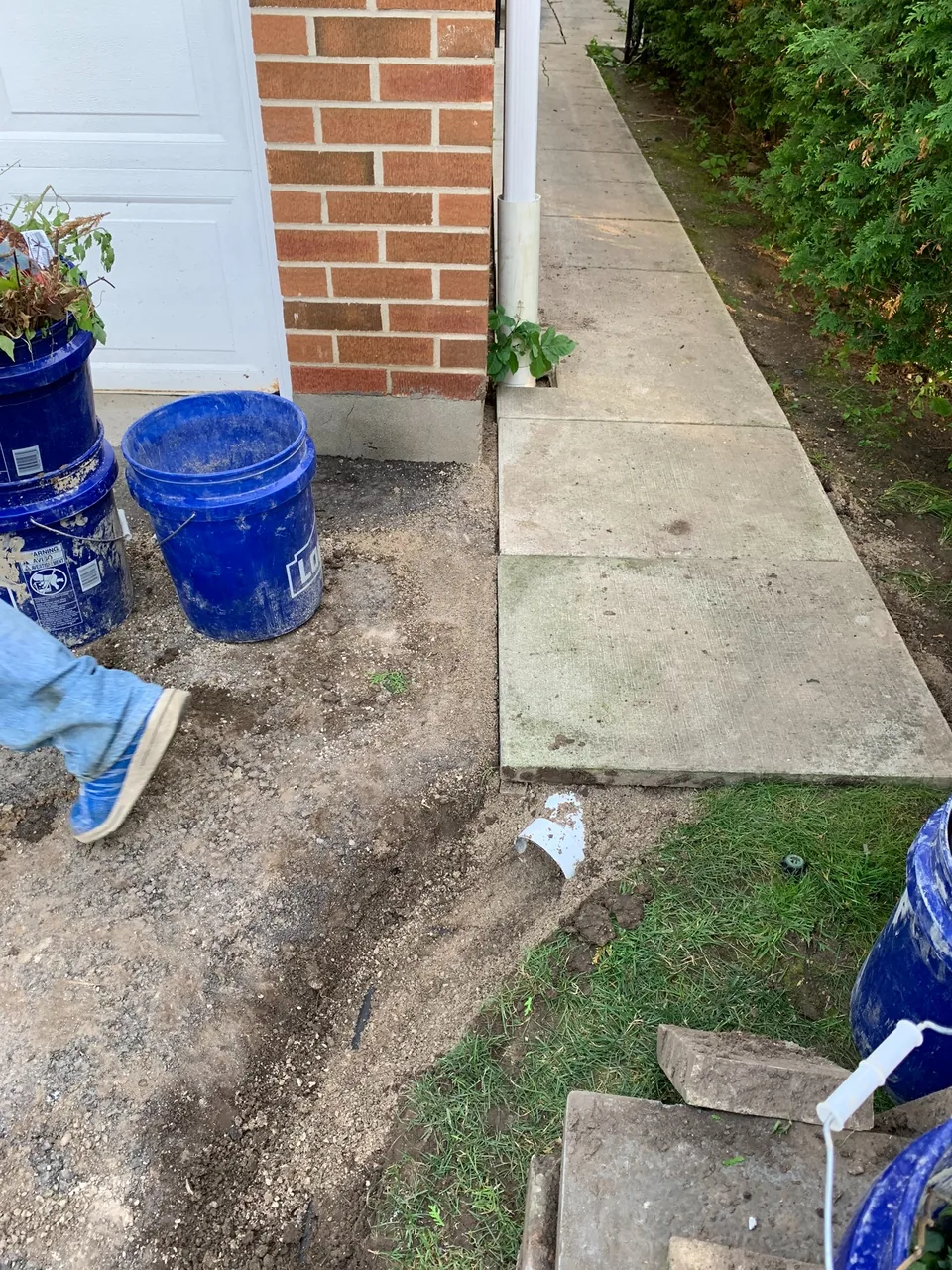 Restored walkway after completion of a downspout project